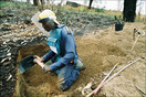 A Halo Trust sapper digging for a mine, Kuito Angola
